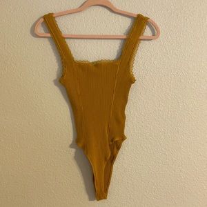 Yellow Ribbed Bodysuit With Lace Edging